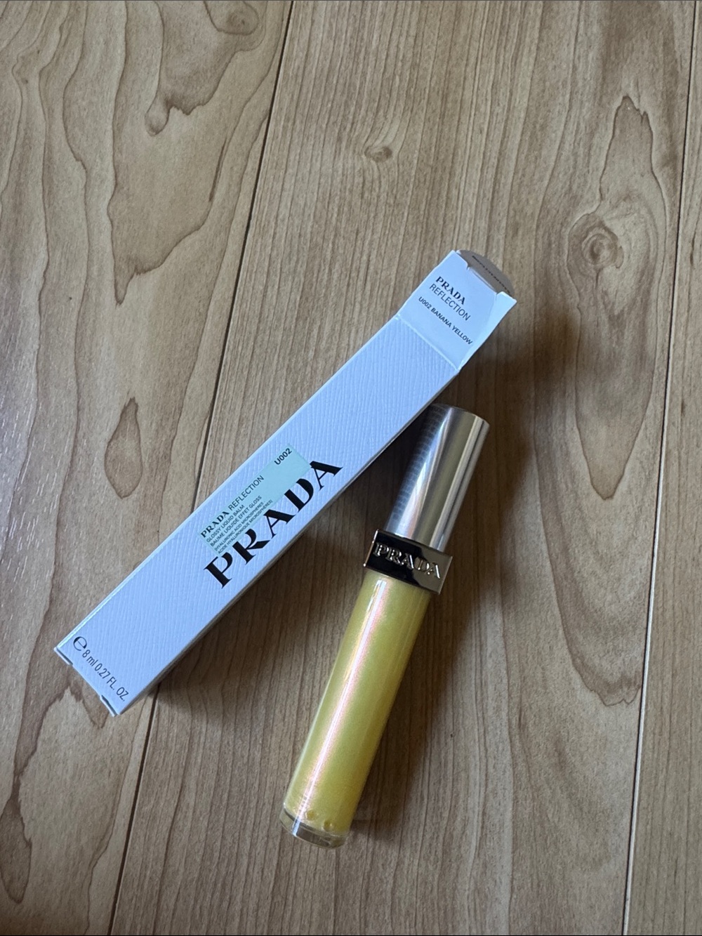 Prada Reflection Lip Gloss in Banana Yellow